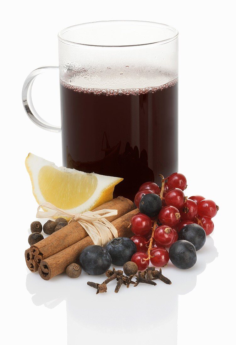 Mulled wine with berries, spices and lemon