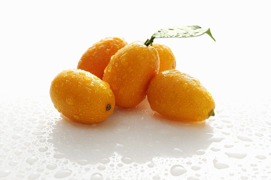 Kumquats with drops of water