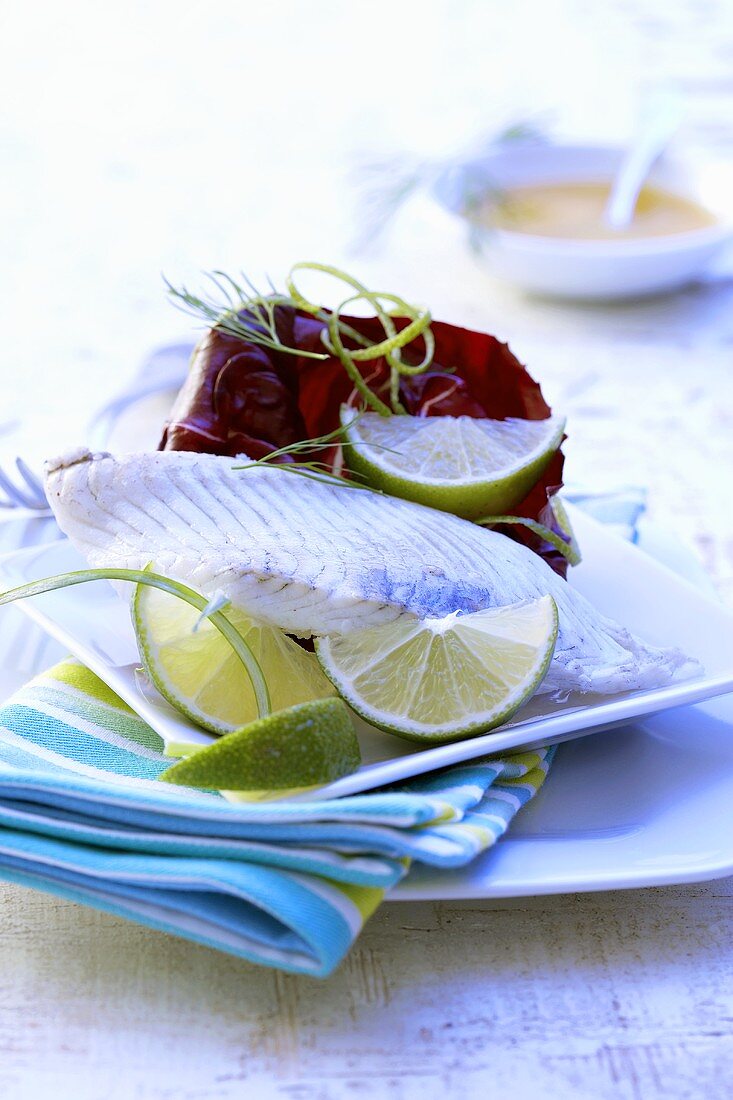 Turbot fillet with lime wedges