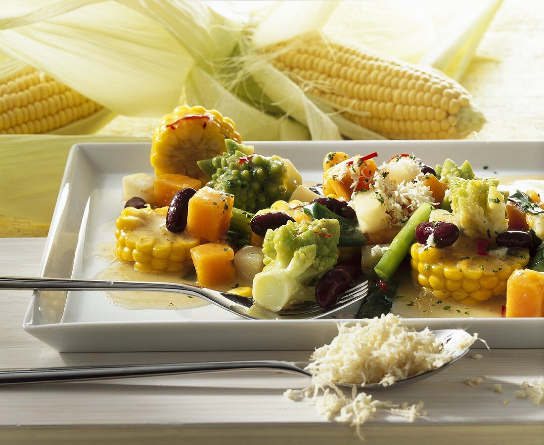 Vegetable stew with corn cob slices and horseradish