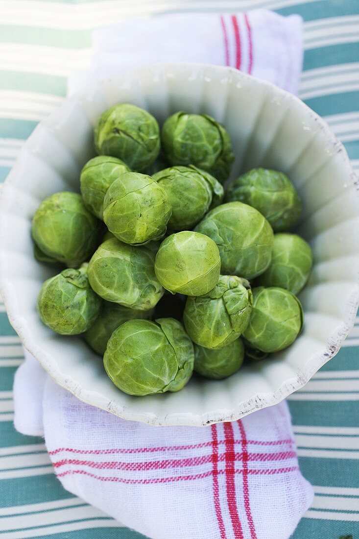 Brussels sprouts in white dish (overhead view)