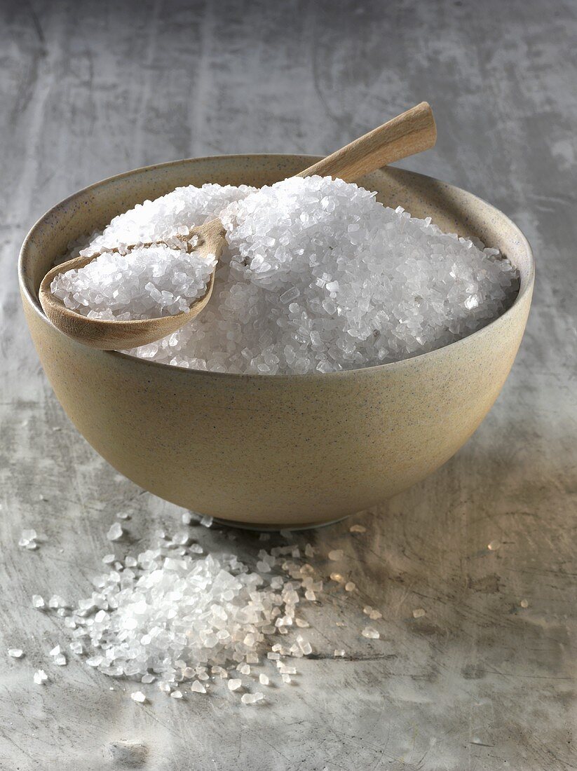 Coarse rock salt in bowl and on spoon