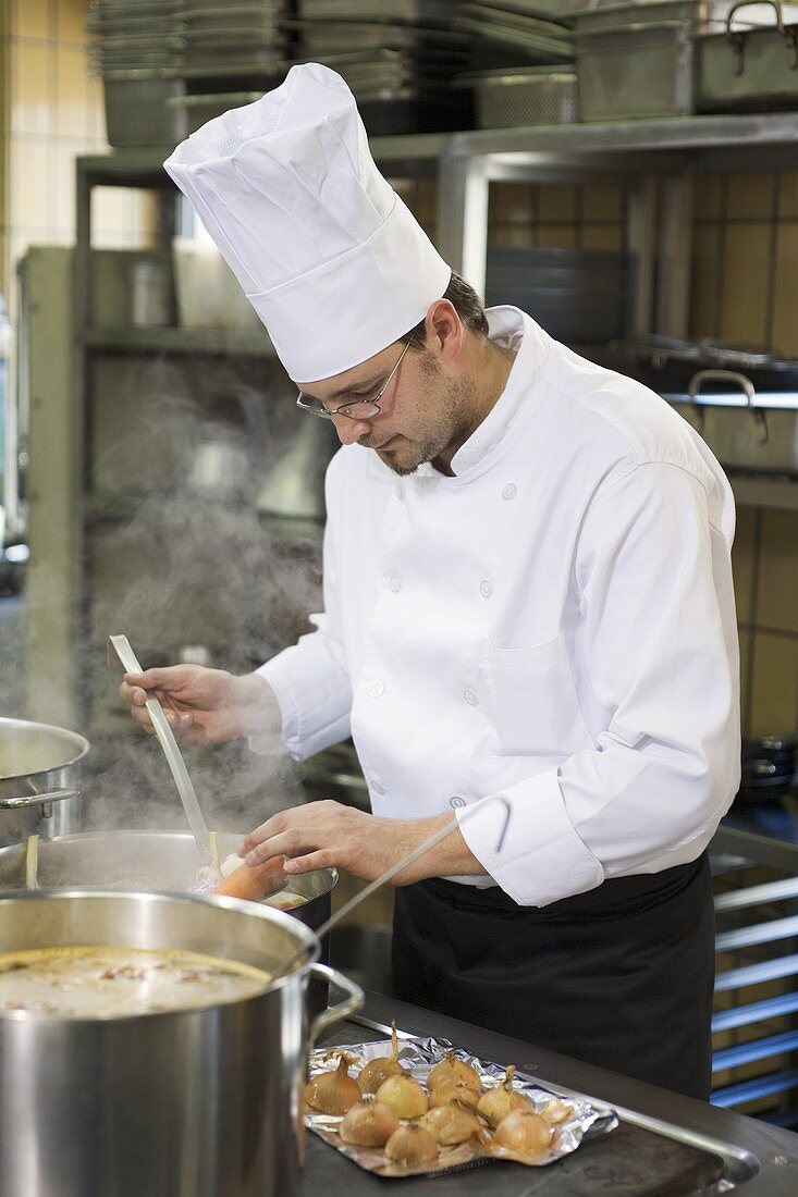 Chef checking cooked vegetables