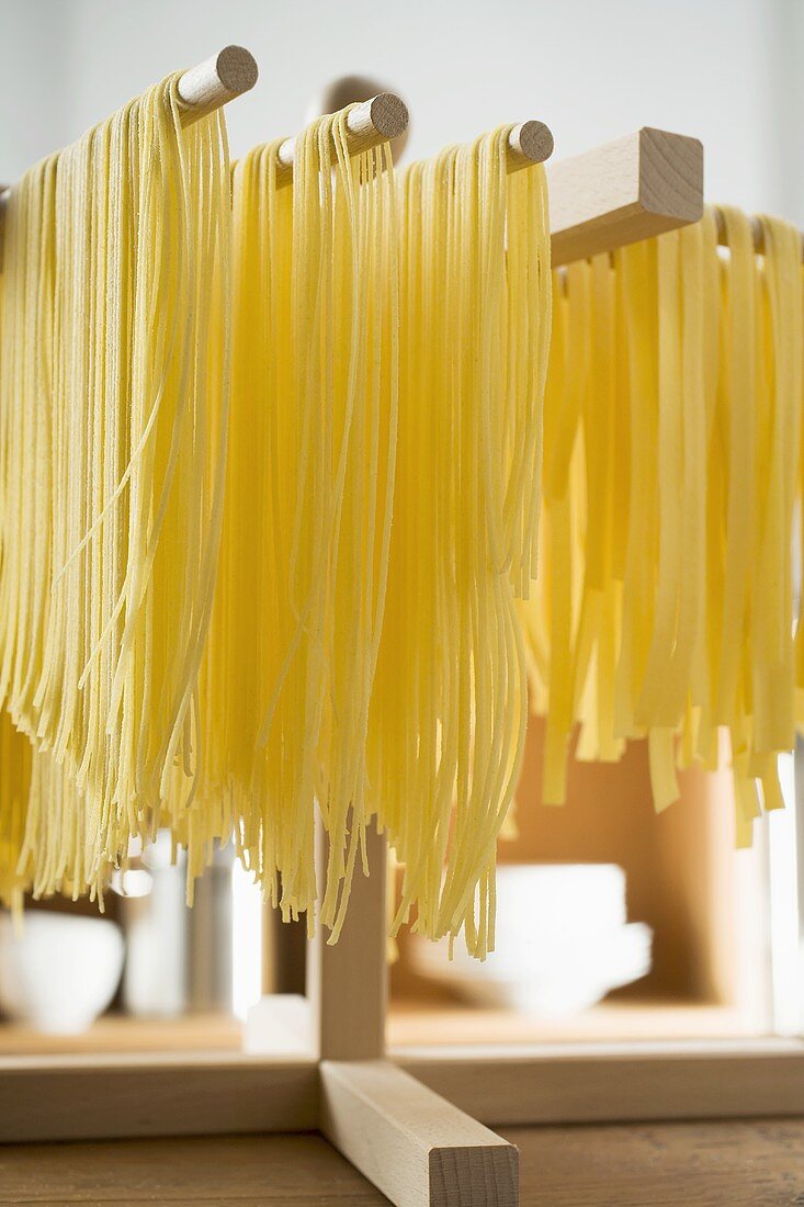 Home-made pasta hanging up to dry