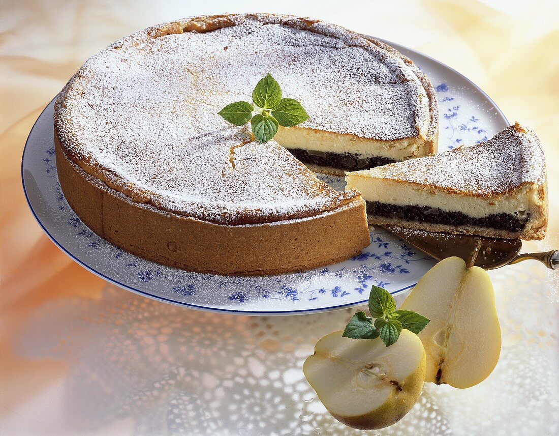 Pear and poppy seed cheesecake, a slice cut