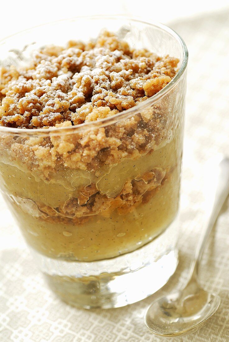 Stewed apple and crumble in a glass