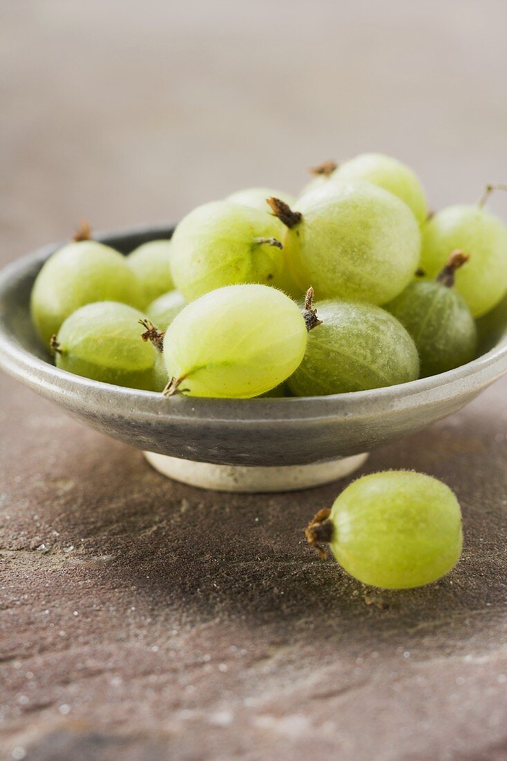 Green gooseberries in bowl