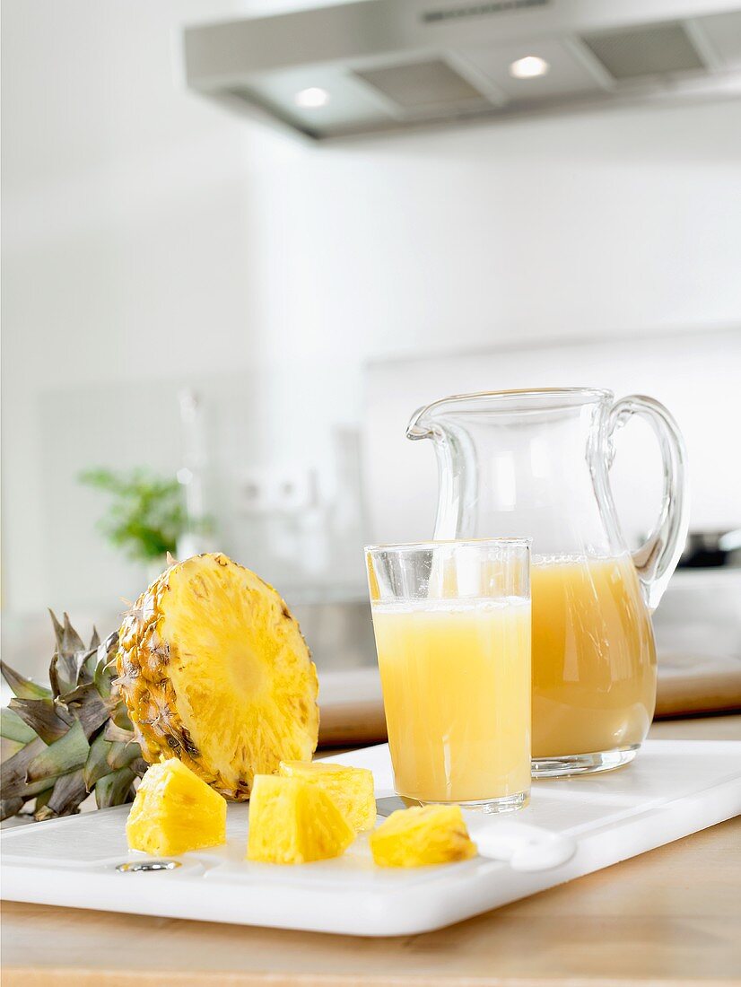 Pineapple juice in glass and jug