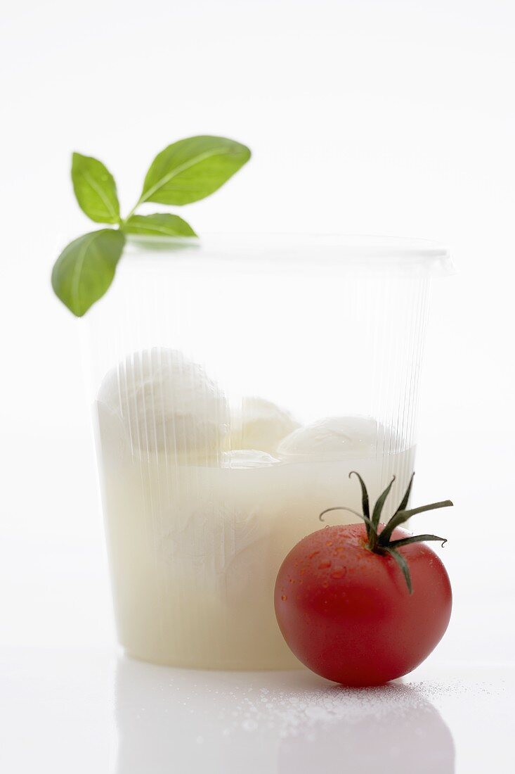 Mozzarella in beaker, tomato and basil