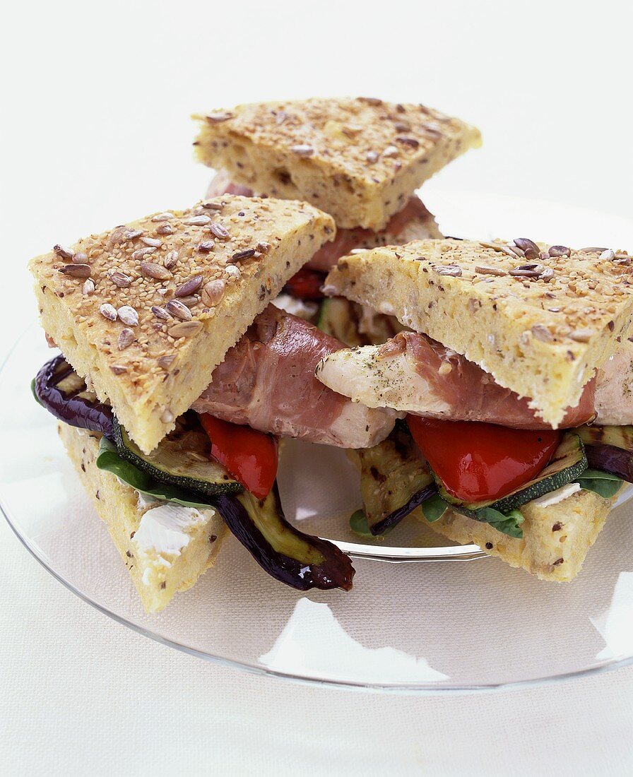 Club sandwiches with chicken, Parma ham and vegetables