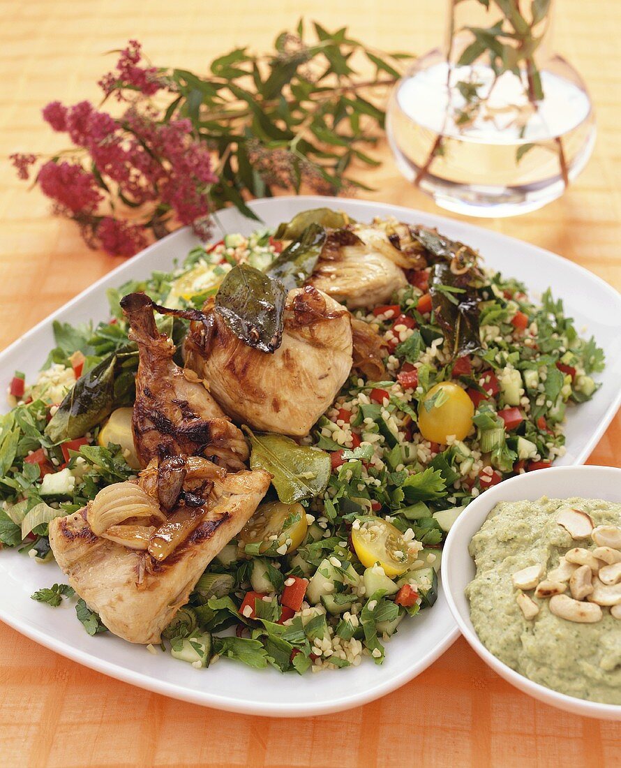 Lemon chicken on bulgur salad with vegetables, cashew dip