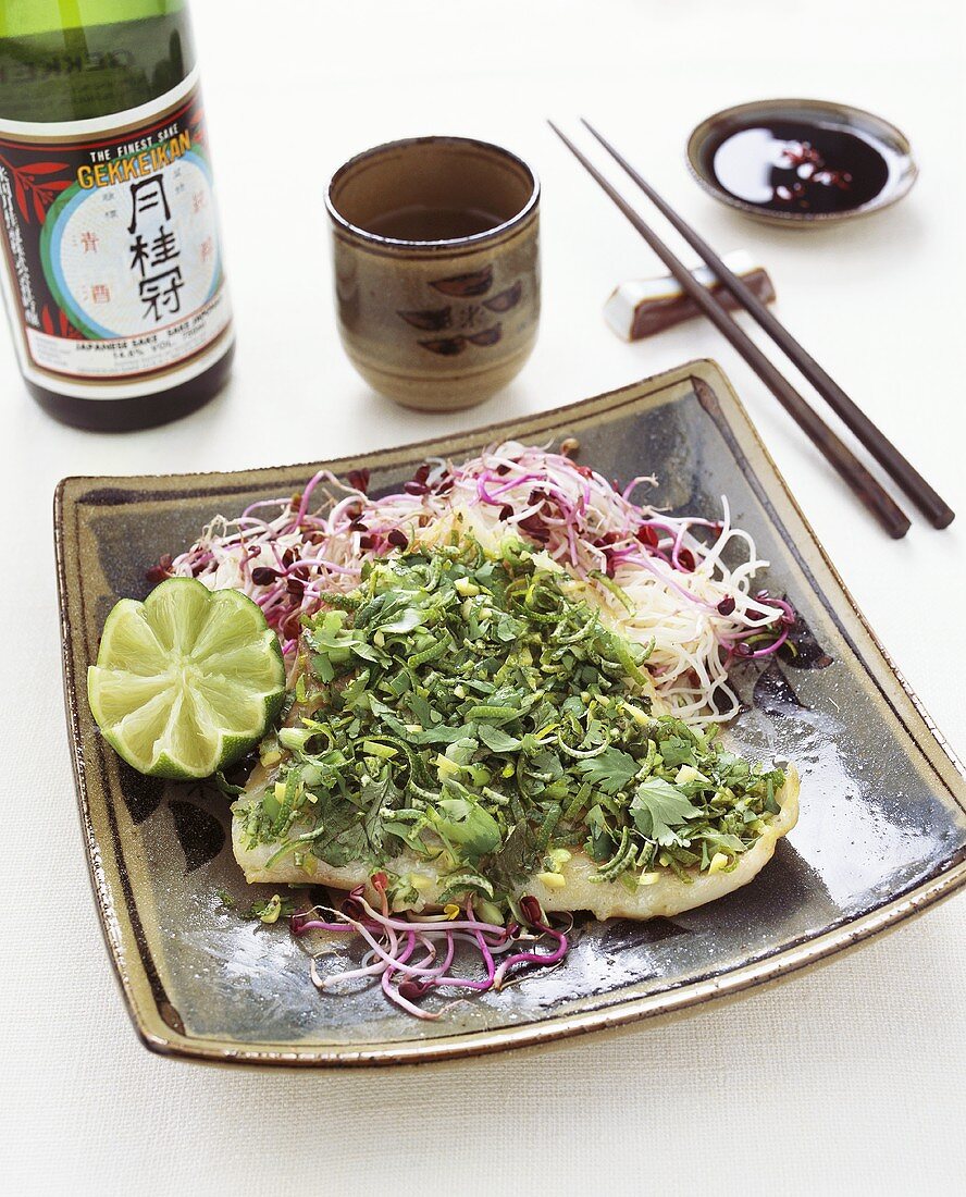 Fish fillet with herbs, lime zest and sprouts (Asia)