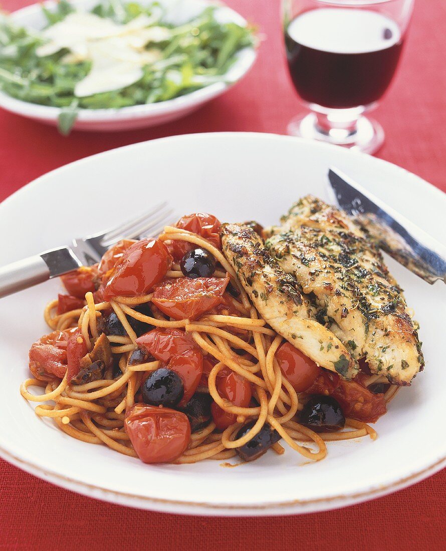 Grilled chicken breast with spaghetti puttanesca (Italy)