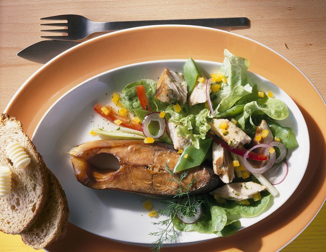 Smoked carp cutlet with salad