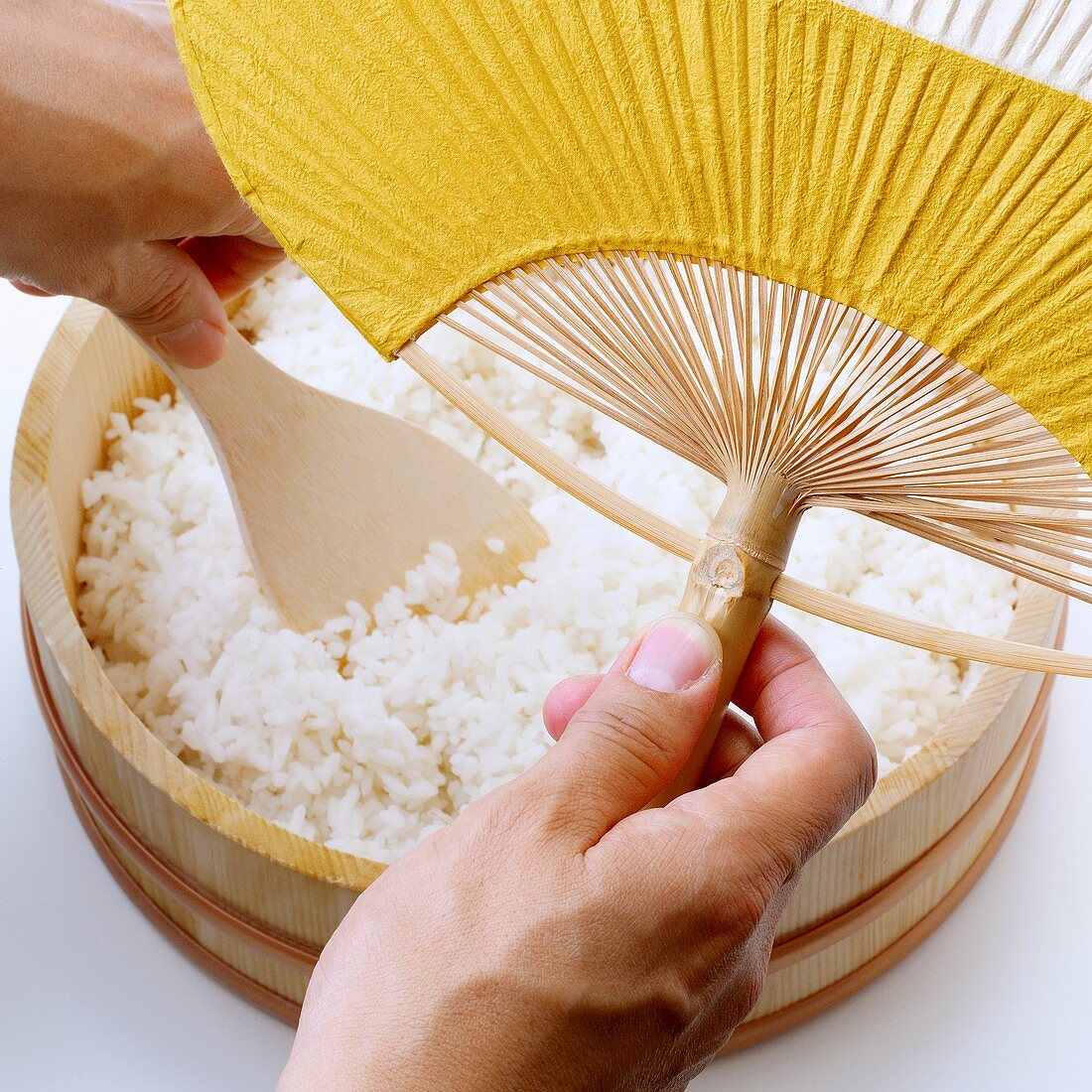 Making sushi rice (cooling with a fan)