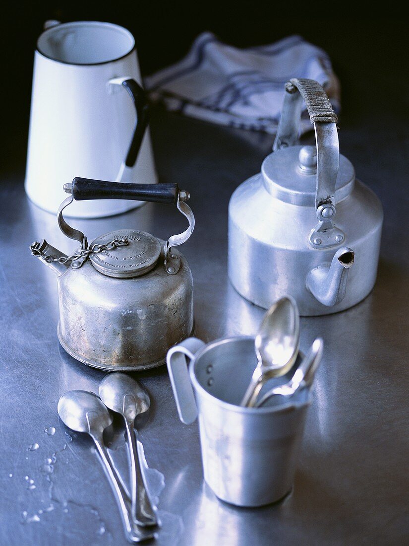 Two old kettles, milk jug, measuring jug and spoons