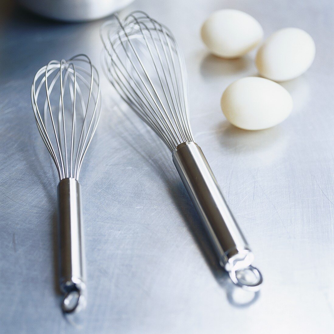Two whisks and three eggs