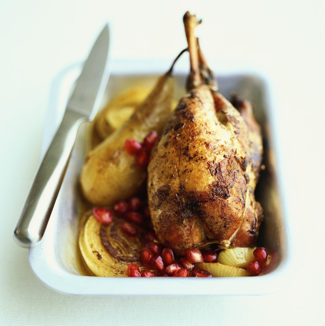Roast partridge with pears and pomegranate seeds