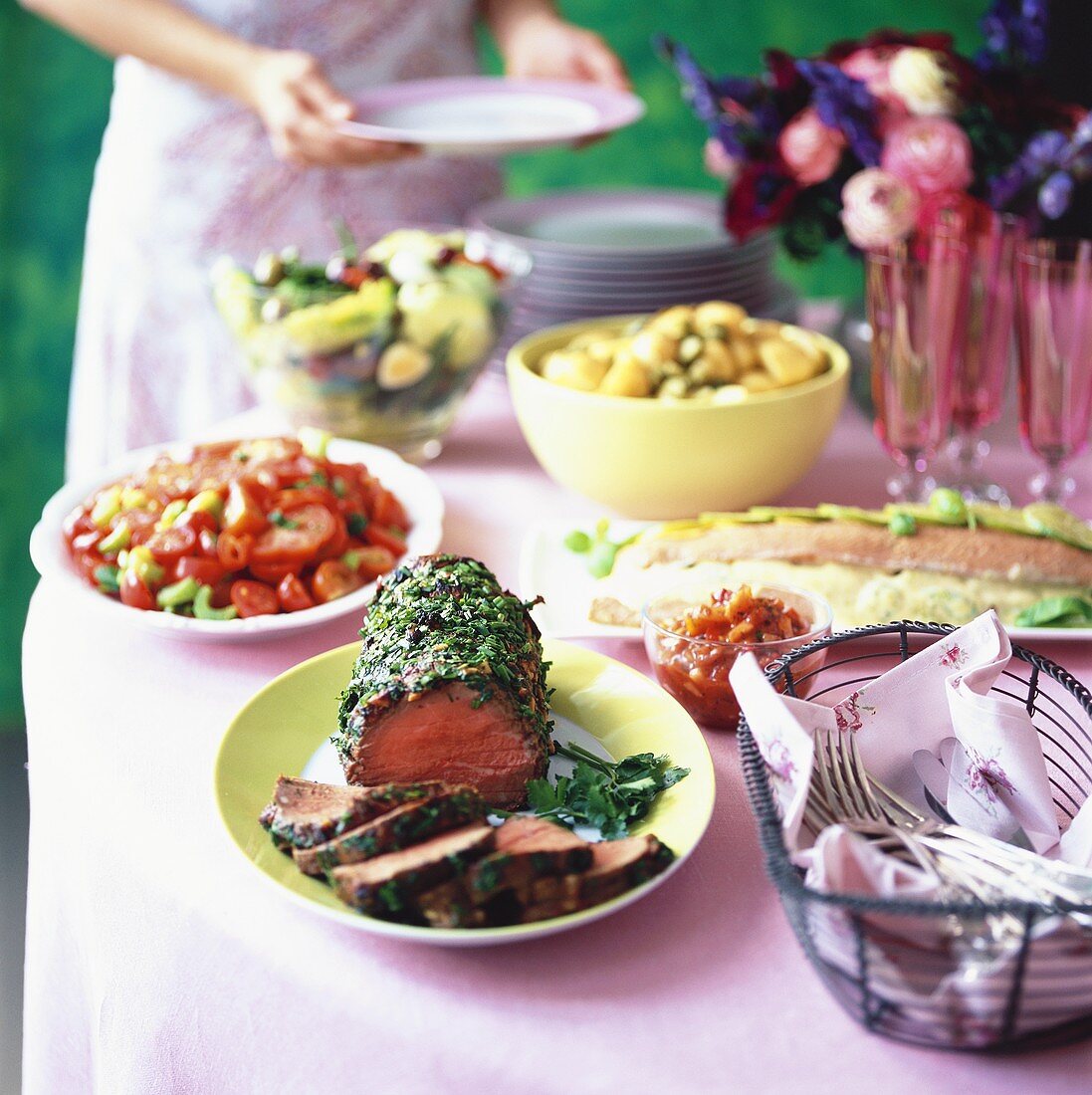 Open-air summer buffet with roast beef and salads