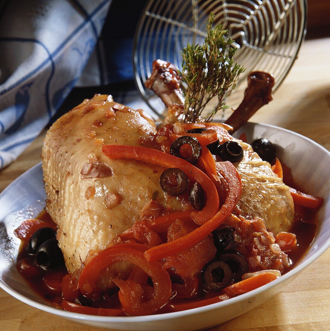 Coq au vin with peppers and olives