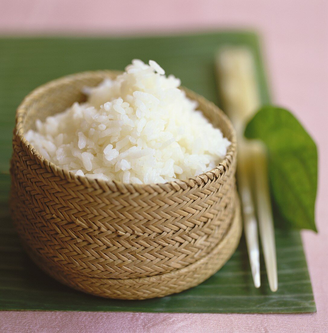 Steamed rice in a bamboo basket