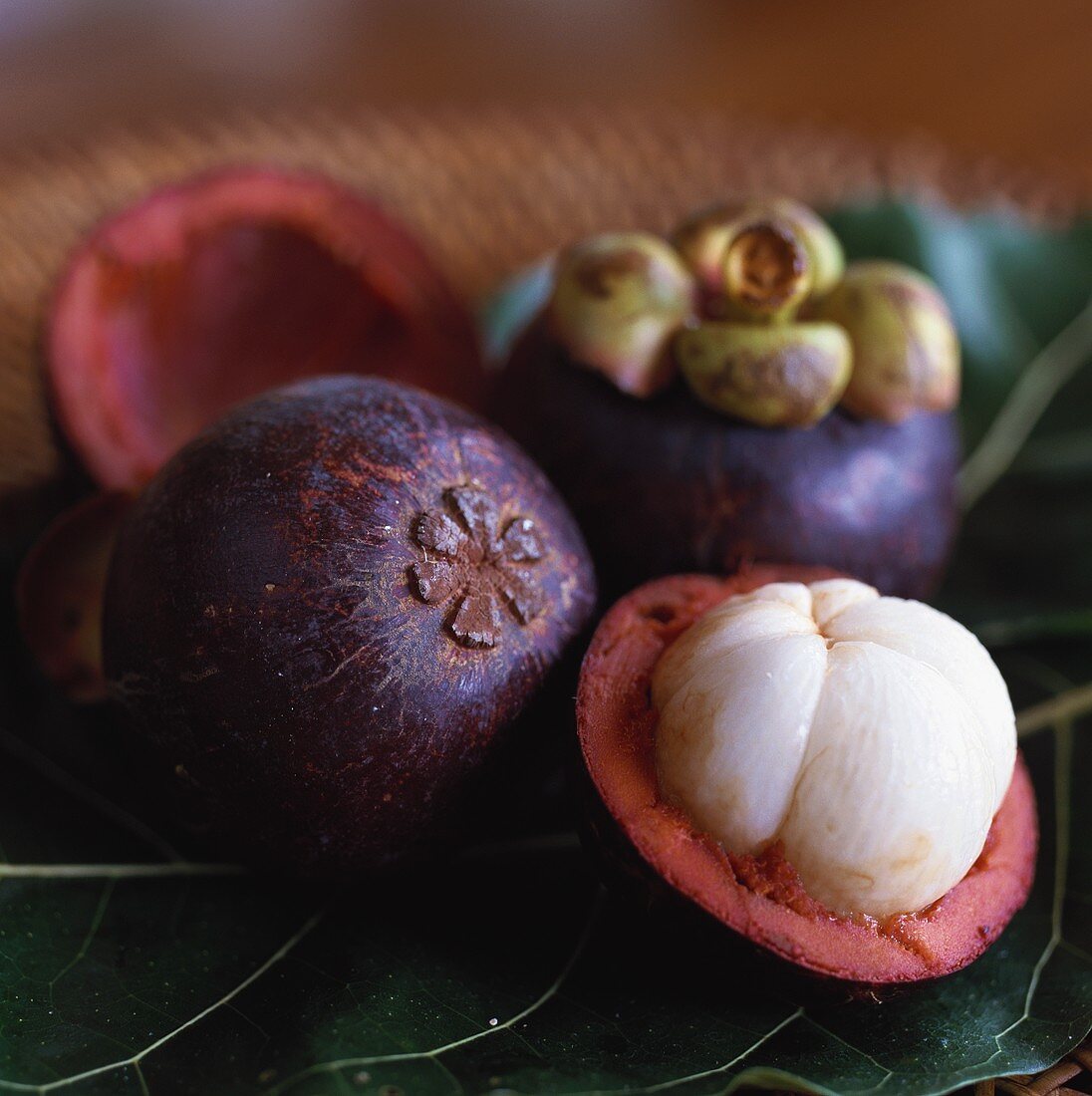 Mangosteens, one halved