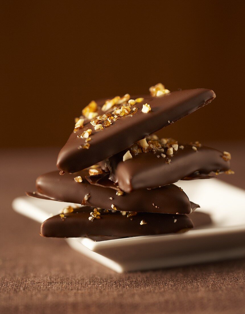 Triangular chocolates with caramel sprinkles