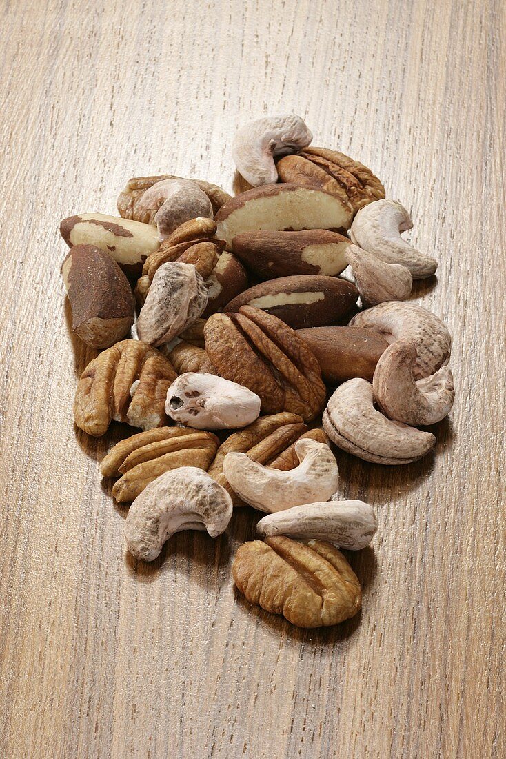 Assorted nuts on wooden background