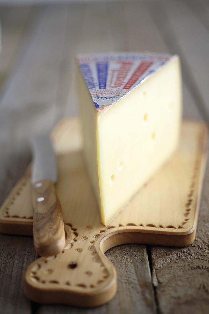 Piece of cheese on chopping board