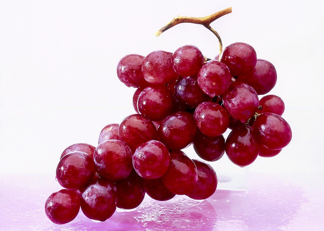 Red grapes with drops of water