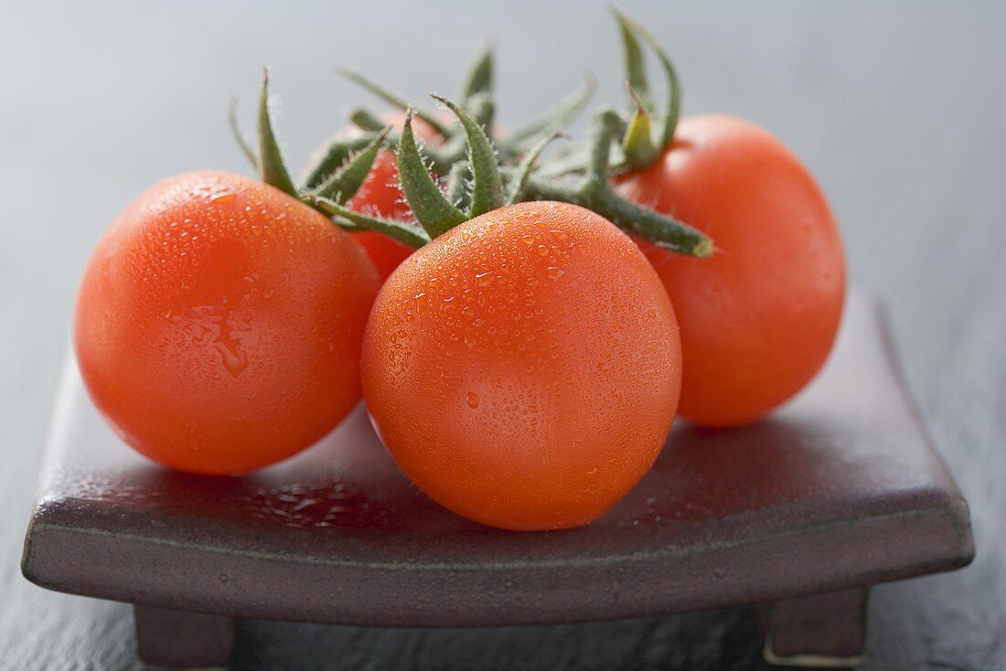 Fresh tomatoes with drops of water