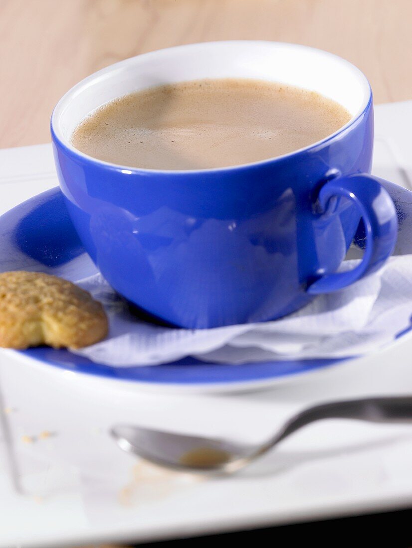 Coffee in blue cup and saucer