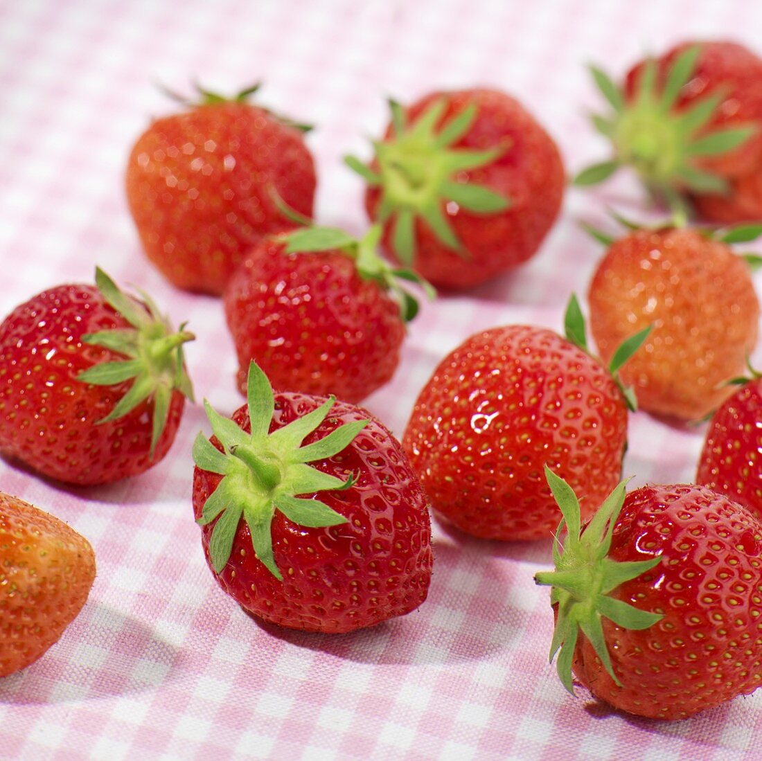 Strawberries on checked tablecloth