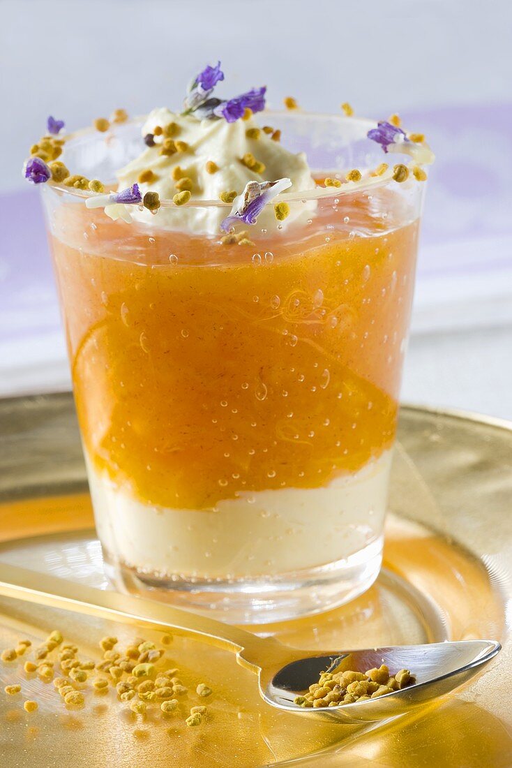 Persimmon puree with cream, pollen and violets