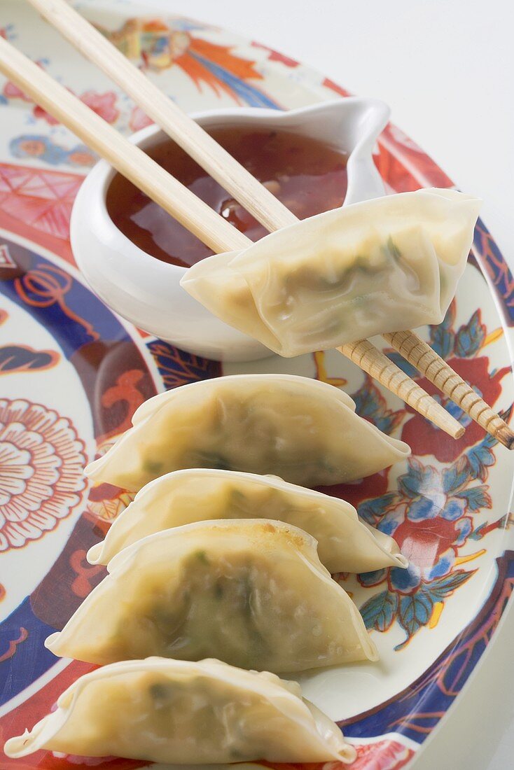 Dim sum with dip on plate (Asia)