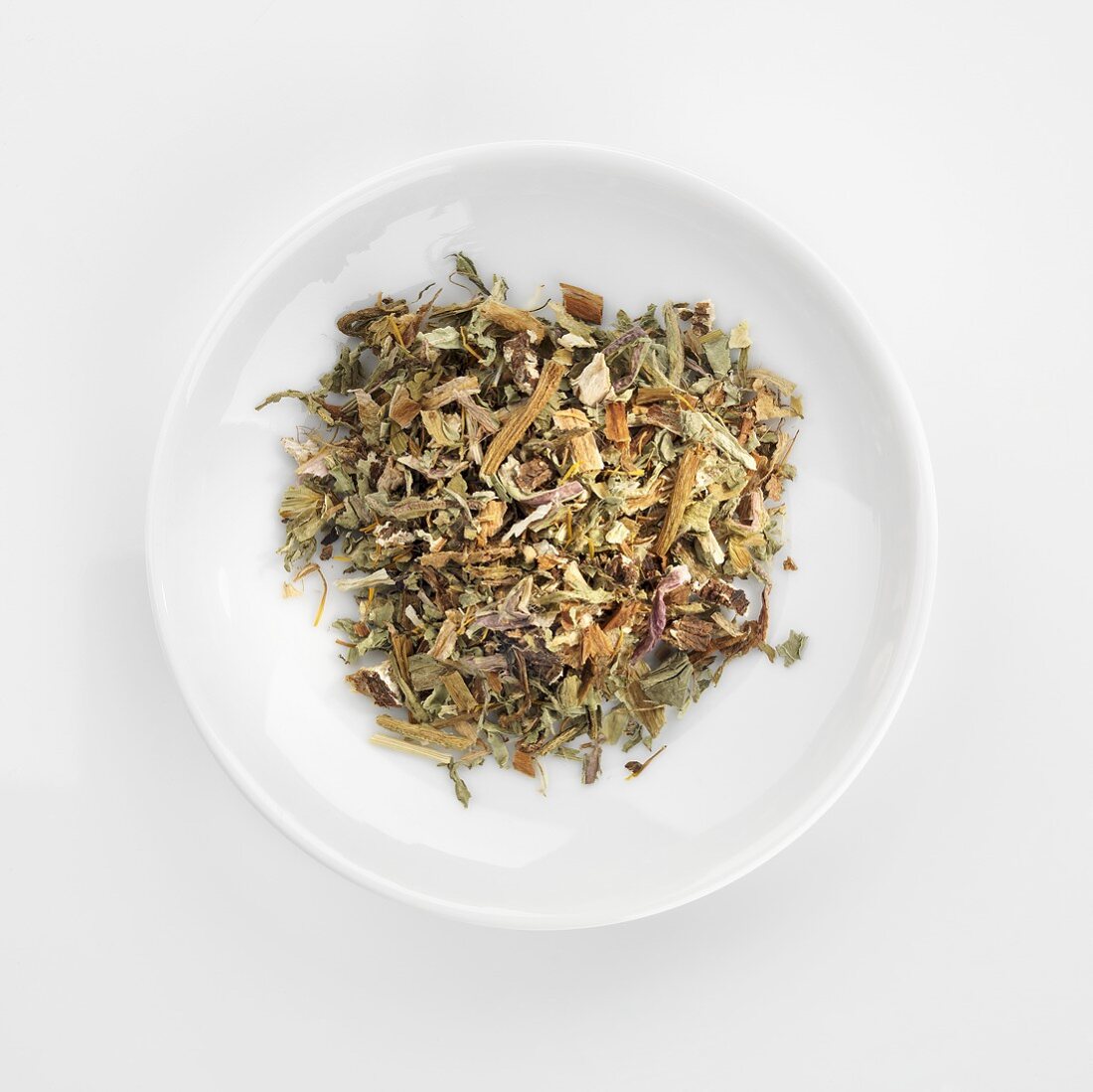 Herbal tea mixture in white dish