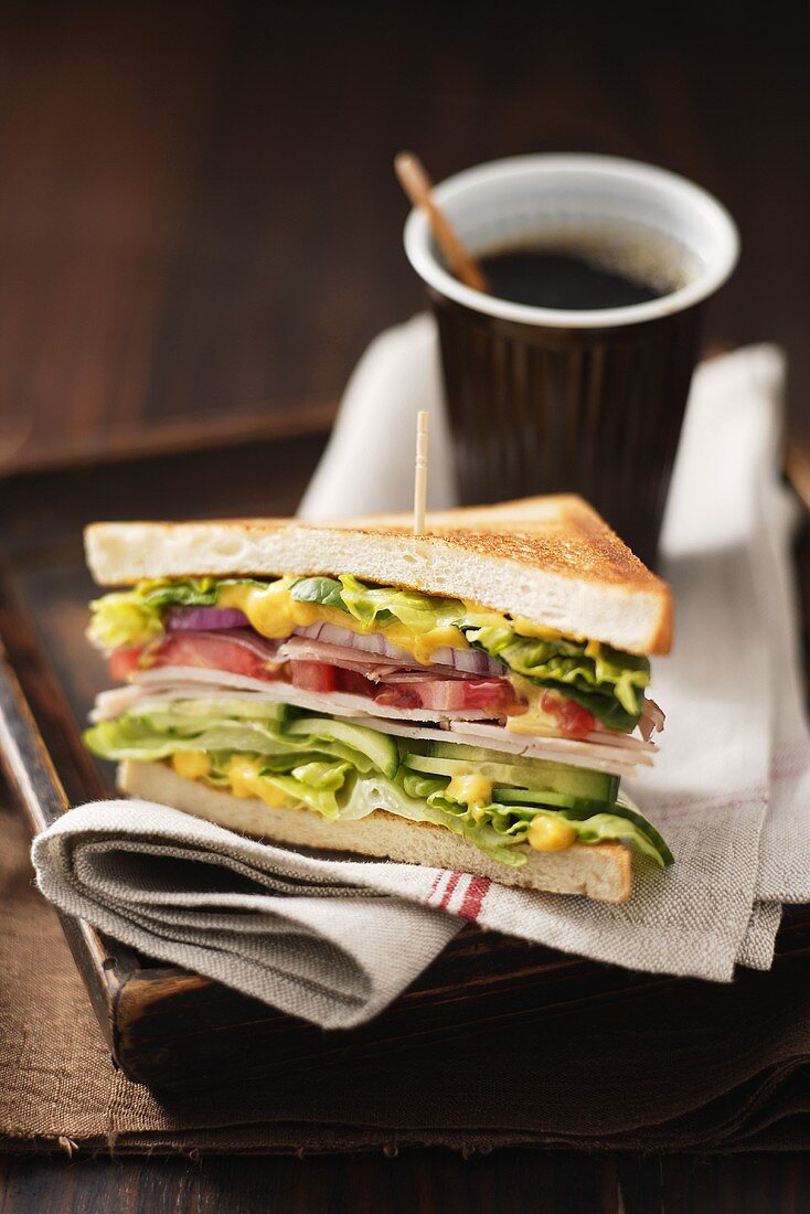 Club sandwich and cup of coffee