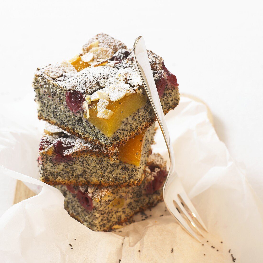 Several pieces of moist poppy seed cake (with fruit)