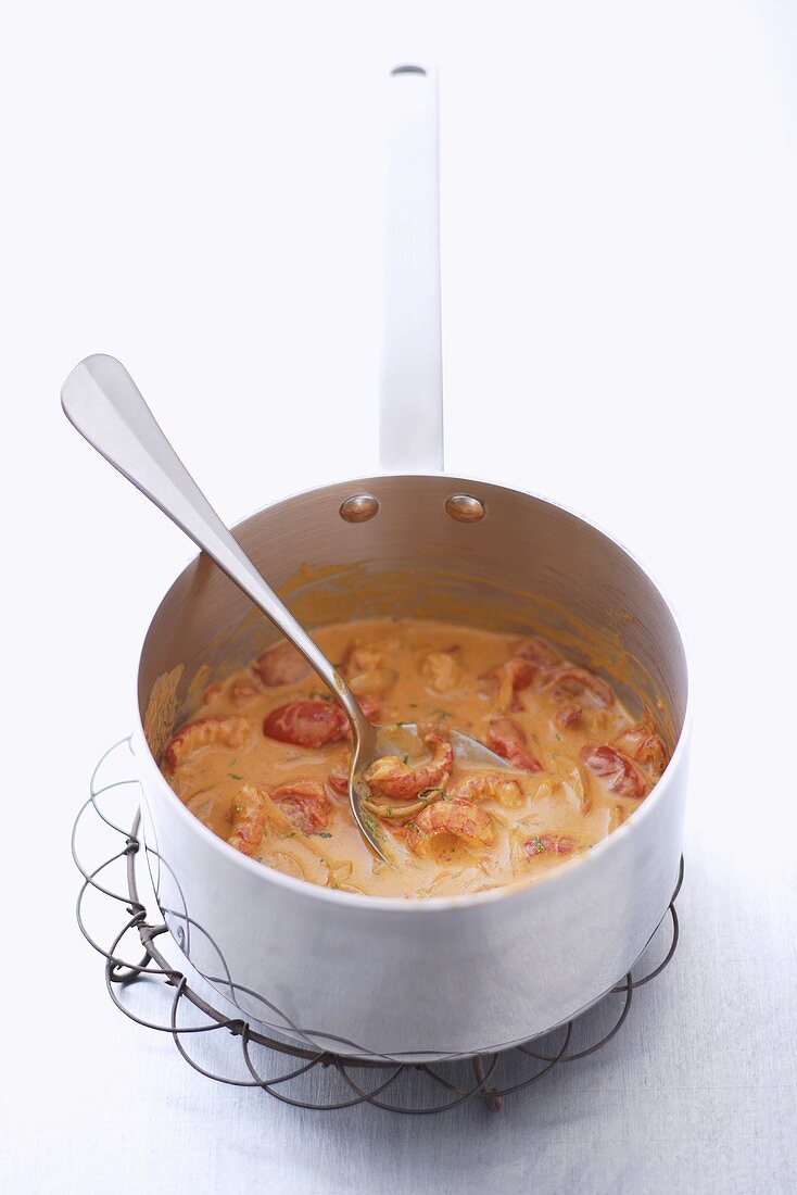 Crayfish sauce in pan with spoon
