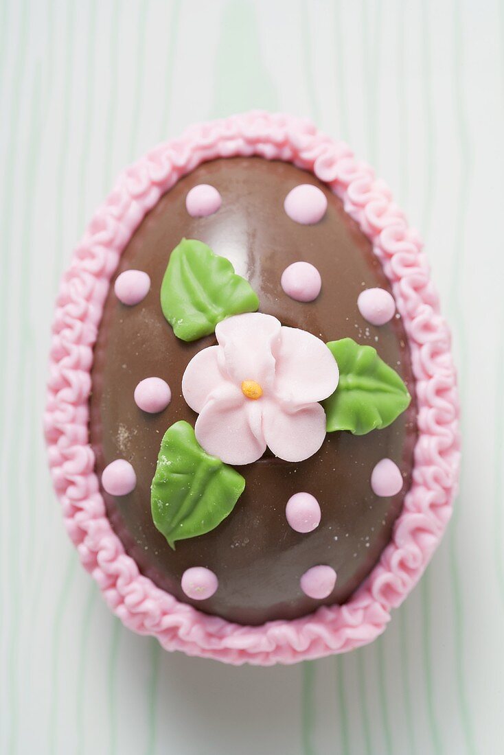 Chocolate Easter egg with sugar flower