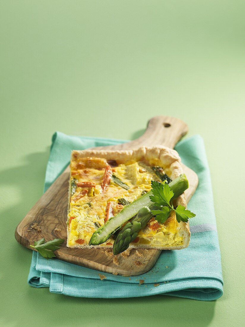 Spring vegetable quiche on chopping board