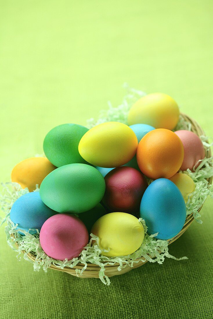 Coloured Easter eggs in a basket