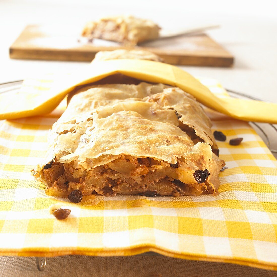 Apple strudel on checked cloth