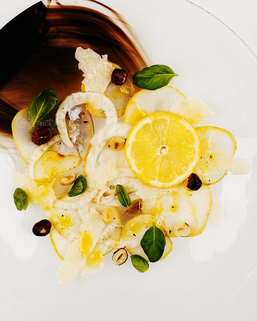 Fennel and pear carpaccio with lemon and hazelnuts