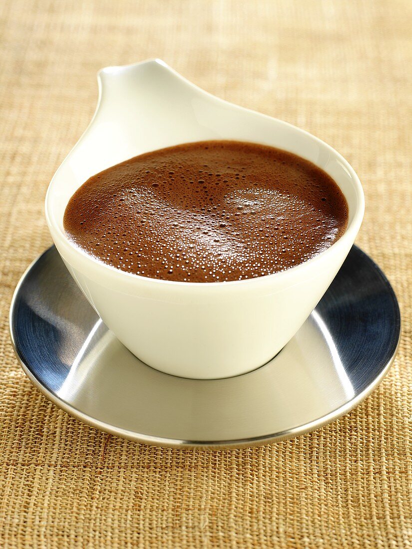 Hot chocolate sauce in sauce-boat