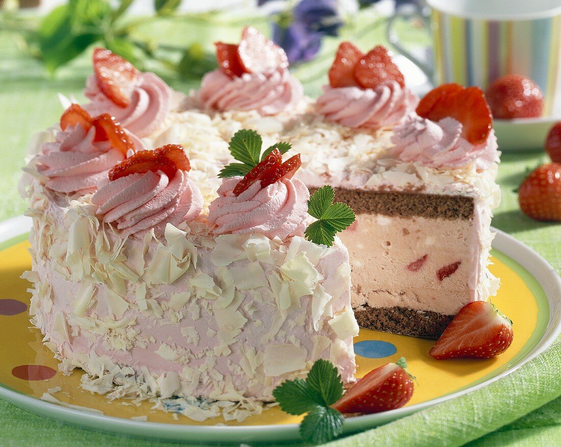 Strawberry ice cream cake, a piece taken