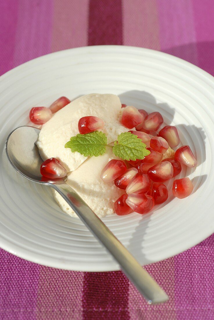 White chocolate mousse with pomegranate seeds