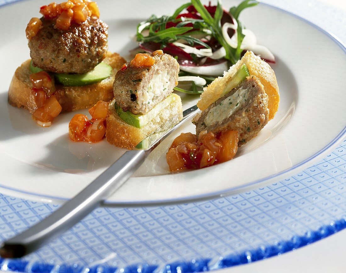 Stuffed meat patties on baguette slices