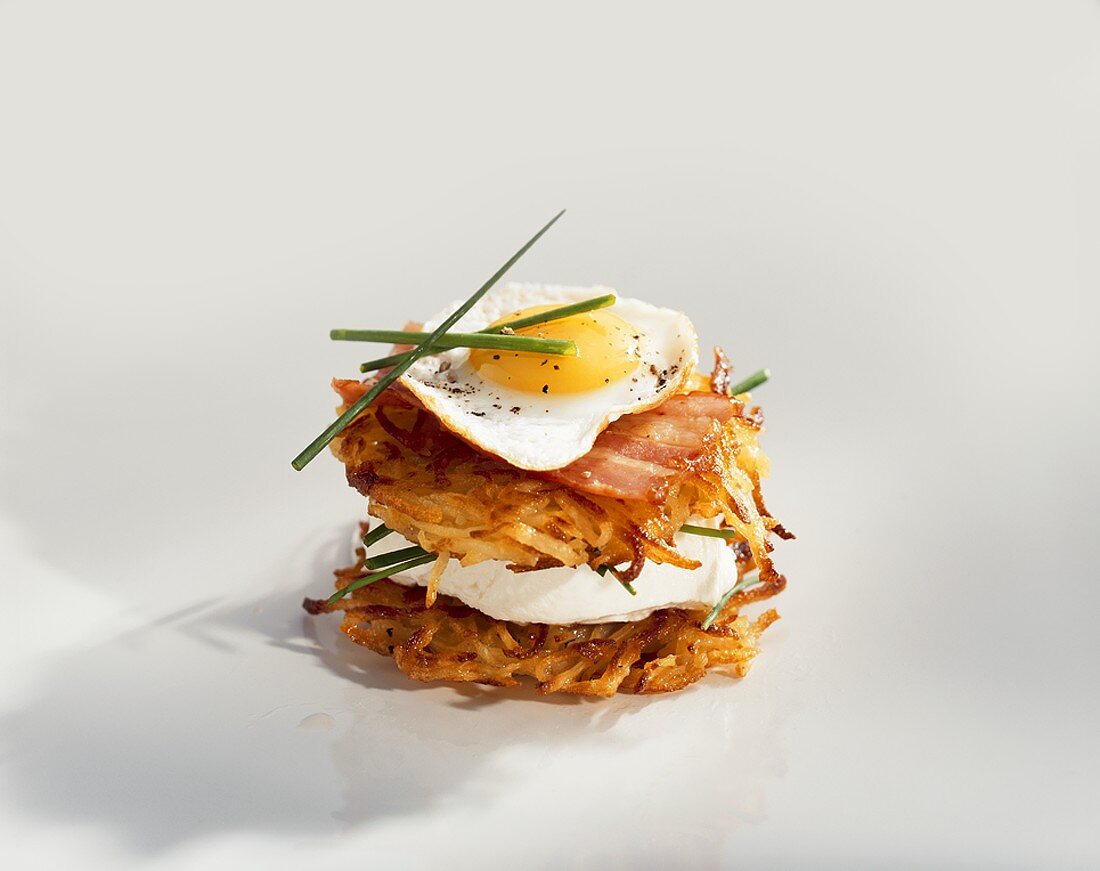 Rosti with cream cheese, bacon and quail's egg