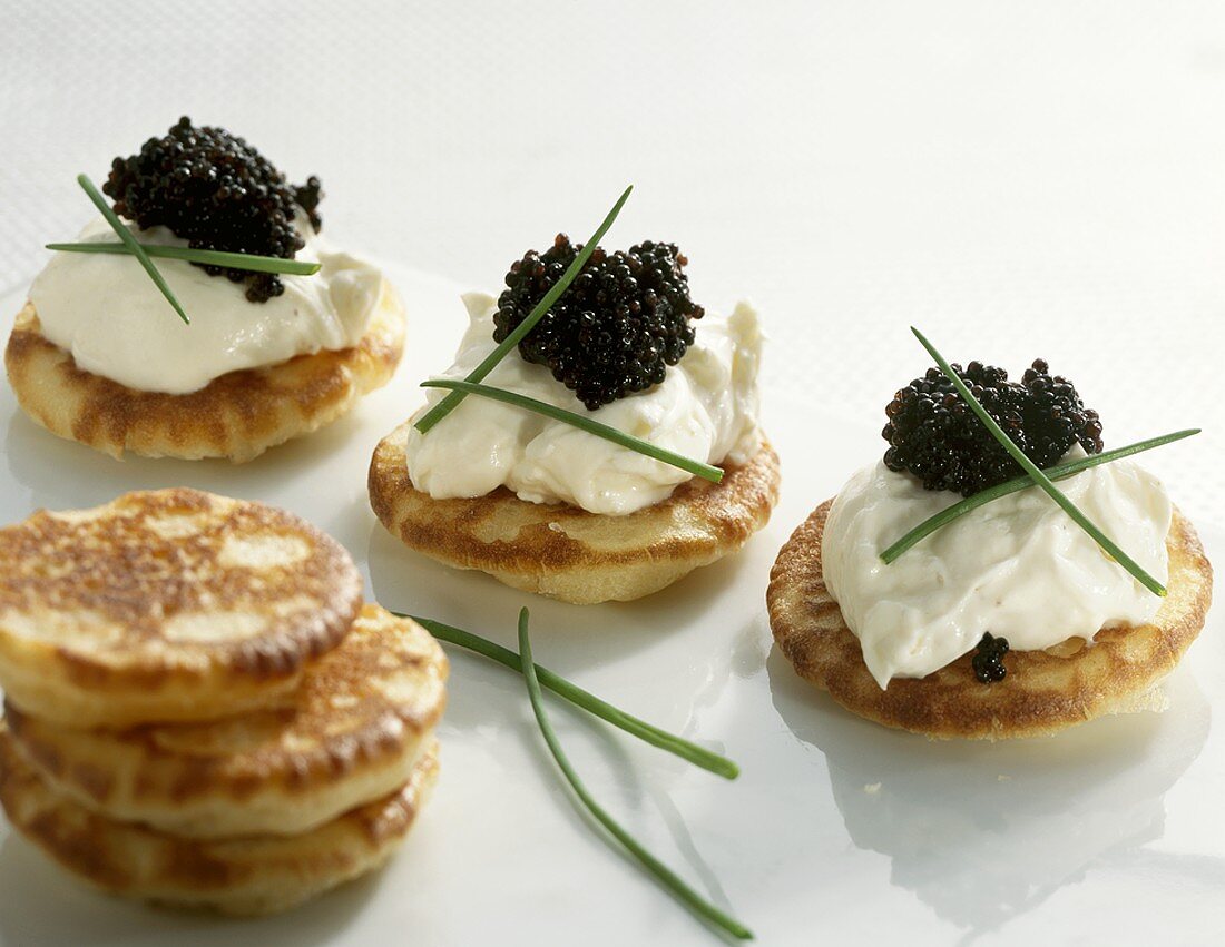 Blinis with soft cheese and caviar